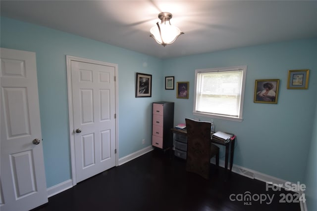 office space featuring dark wood-style floors and baseboards