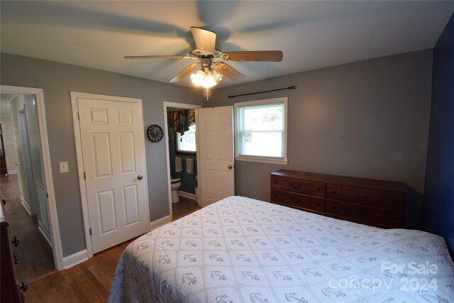 bedroom with light hardwood / wood-style flooring, ceiling fan, and ensuite bathroom