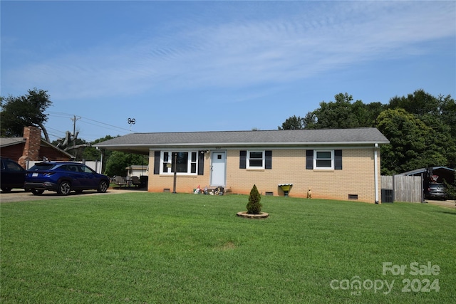 ranch-style home with crawl space, a front lawn, an attached carport, and brick siding