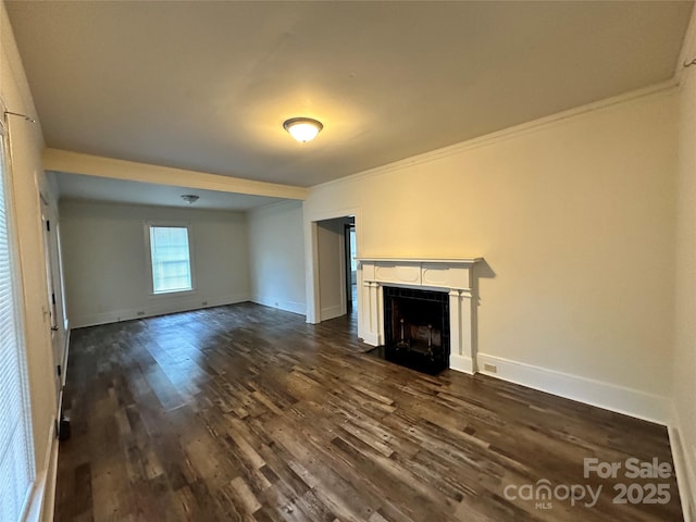 unfurnished living room featuring a fireplace with flush hearth, baseboards, dark wood-type flooring, and ornamental molding