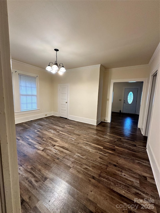 unfurnished dining area with a chandelier, dark wood-type flooring, and crown molding