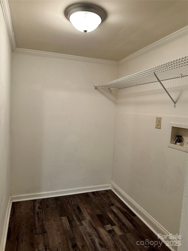 washroom featuring dark wood-style flooring, hookup for a washing machine, ornamental molding, laundry area, and baseboards