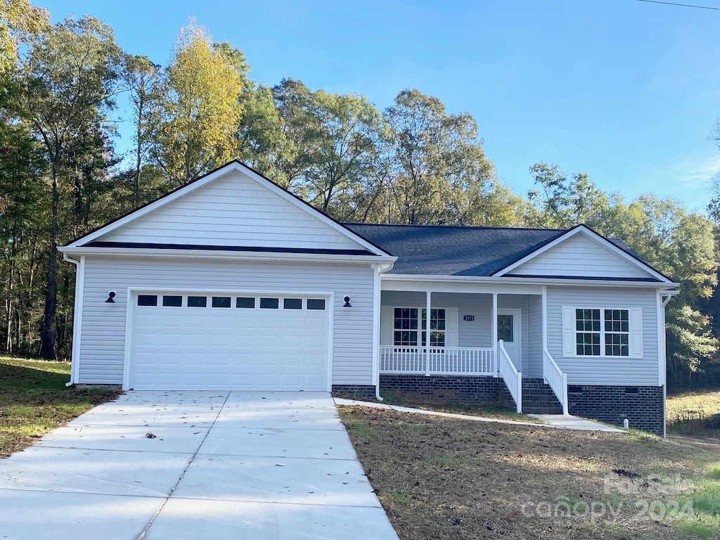 single story home with an attached garage, crawl space, a porch, and concrete driveway