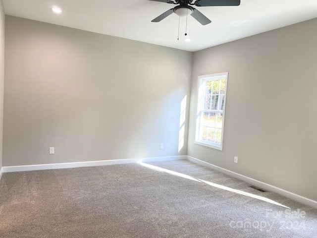 carpeted empty room with recessed lighting, visible vents, ceiling fan, and baseboards