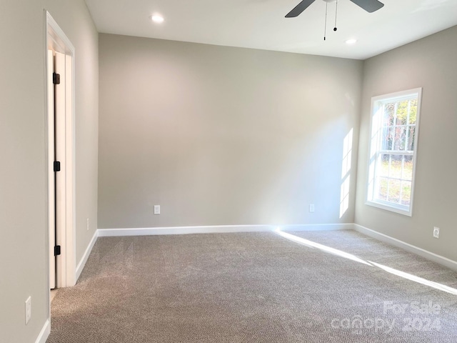 carpeted spare room with ceiling fan, baseboards, and recessed lighting