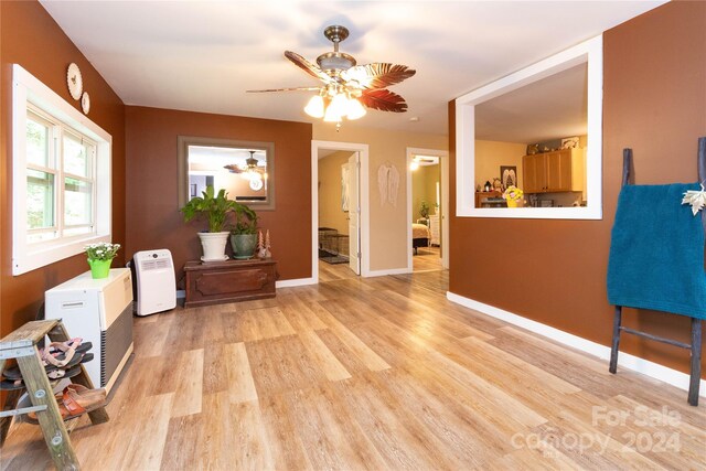 interior space featuring light wood-type flooring and ceiling fan