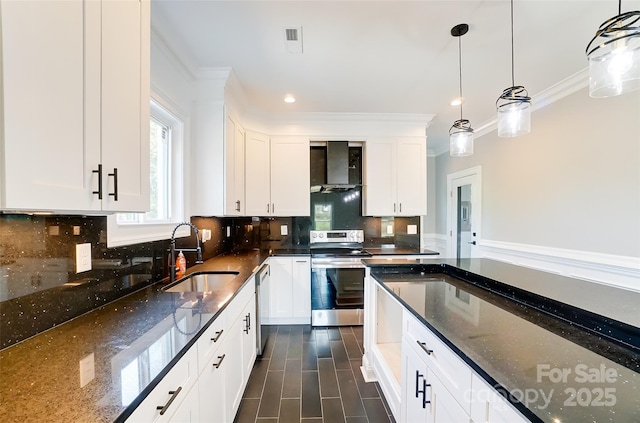 kitchen featuring pendant lighting, sink, dark stone countertops, white cabinetry, and stainless steel appliances