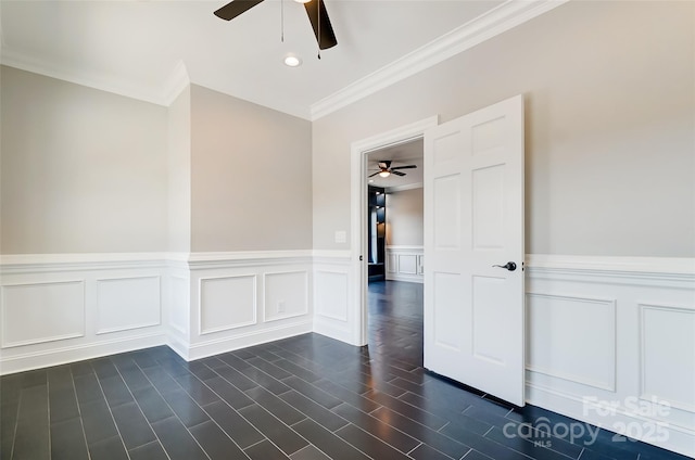 empty room featuring crown molding