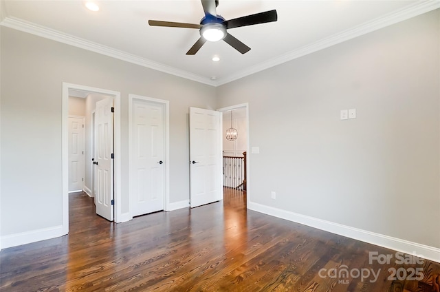 unfurnished bedroom with ceiling fan, dark wood-type flooring, and ornamental molding