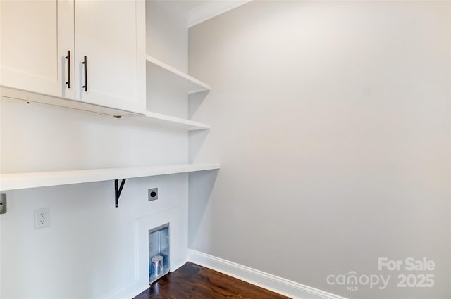 laundry area with cabinets, dark hardwood / wood-style floors, and electric dryer hookup