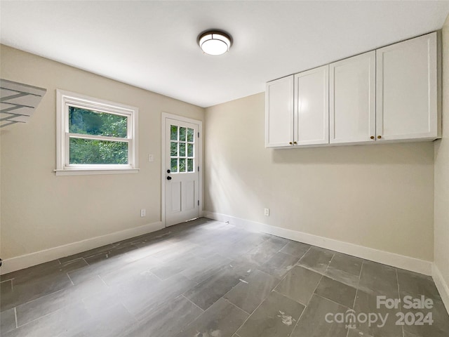 empty room with tile patterned flooring