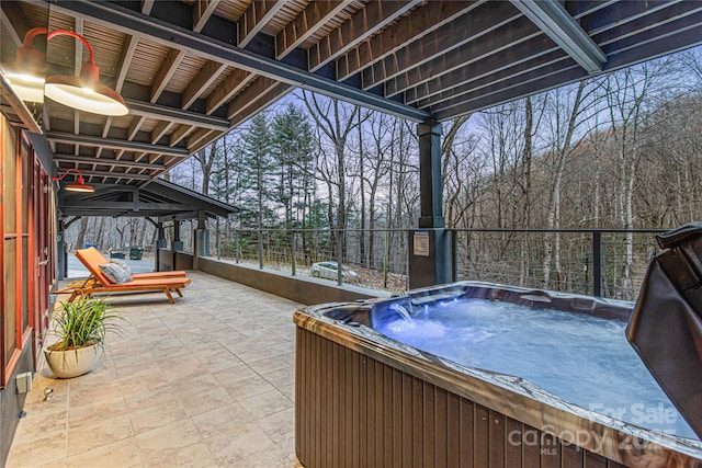 view of patio with a hot tub