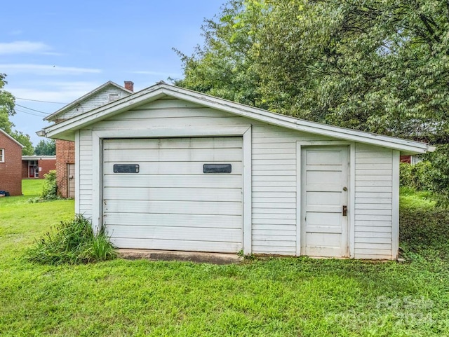 view of outbuilding featuring a yard