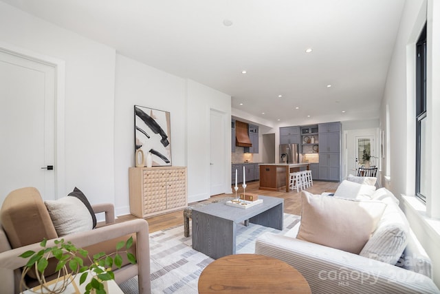 living room with light hardwood / wood-style flooring