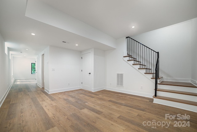 interior space with hardwood / wood-style floors