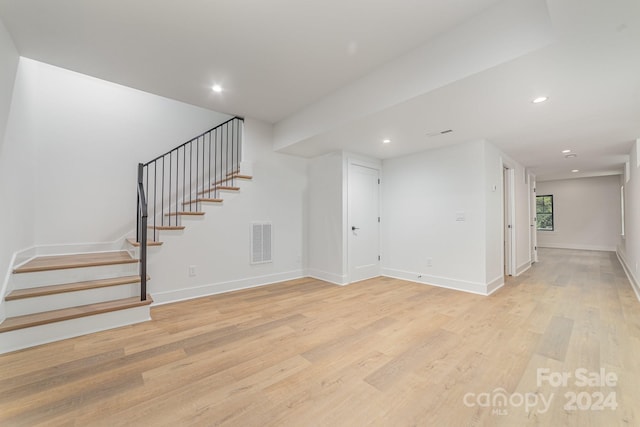 unfurnished living room with light wood-type flooring