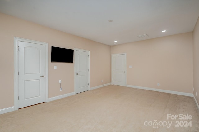 unfurnished bedroom featuring light colored carpet