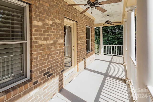 balcony with ceiling fan and a porch