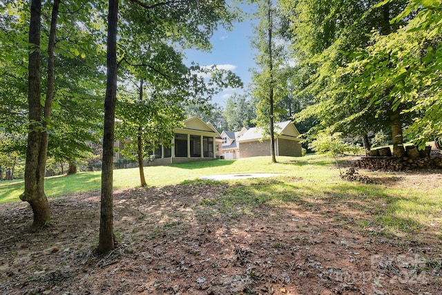 view of yard with a sunroom