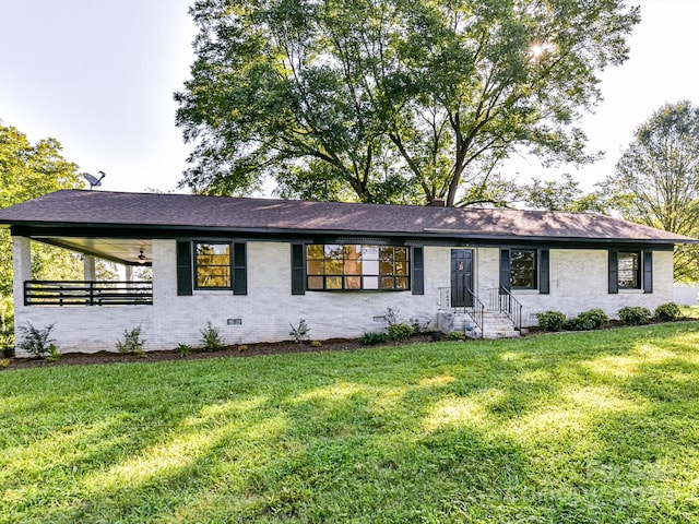 ranch-style house featuring a front lawn