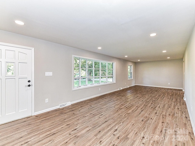 spare room featuring light hardwood / wood-style floors