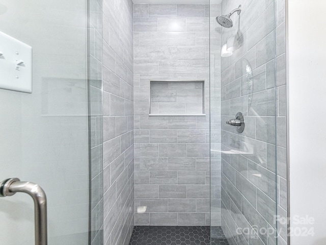 bathroom featuring an enclosed shower