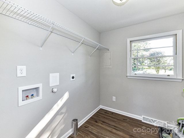 washroom with dark hardwood / wood-style floors, washer hookup, and electric dryer hookup