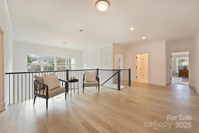 sitting room with light hardwood / wood-style flooring