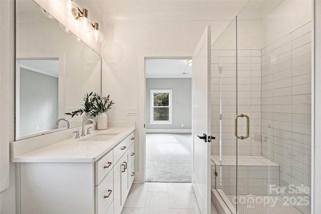 bathroom featuring vanity and an enclosed shower