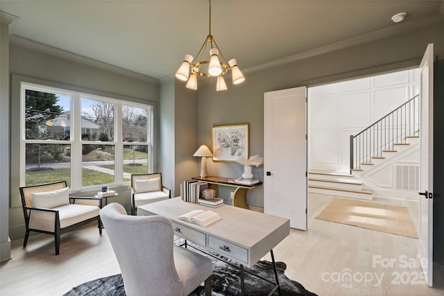 office area featuring a chandelier, crown molding, and hardwood / wood-style floors