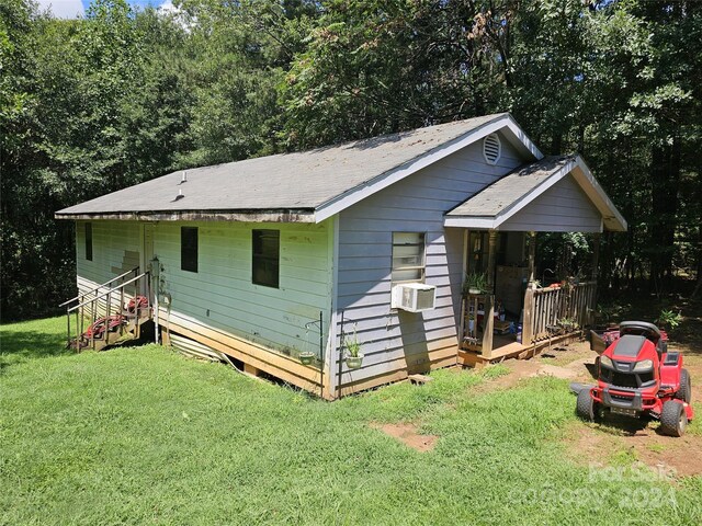 view of outdoor structure with a lawn