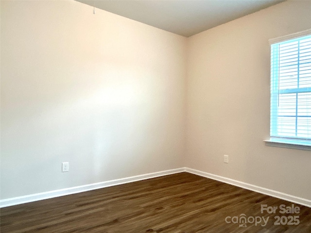 unfurnished room featuring dark hardwood / wood-style floors