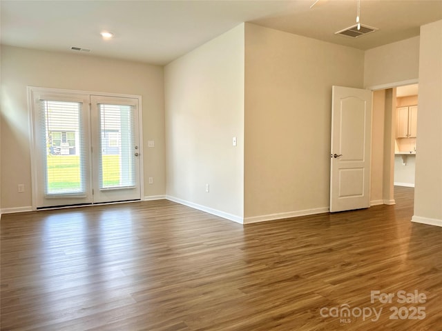 empty room featuring dark wood-type flooring