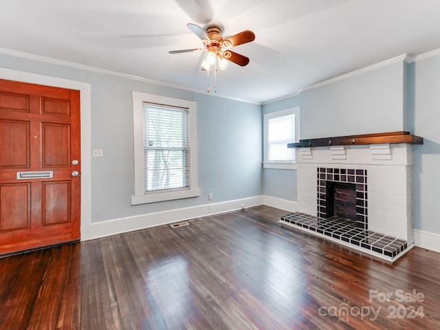 unfurnished living room with crown molding, a fireplace, and hardwood / wood-style floors