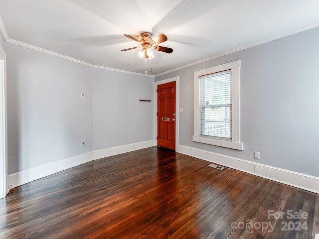 spare room featuring crown molding, ceiling fan, and dark hardwood / wood-style floors