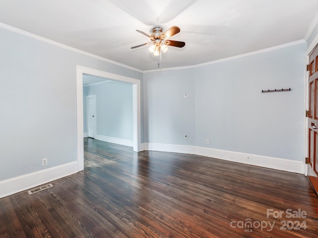 spare room with crown molding, ceiling fan, and dark hardwood / wood-style floors