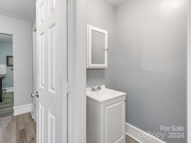 bathroom featuring vanity and hardwood / wood-style floors