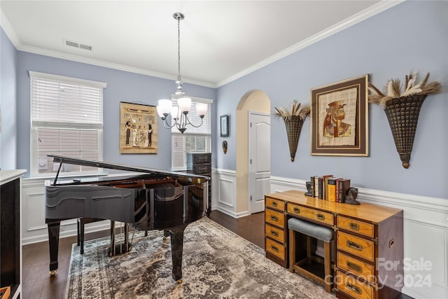 living area featuring visible vents, arched walkways, a wainscoted wall, dark wood-style floors, and ornamental molding