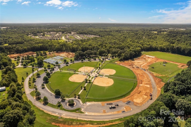 birds eye view of property with a wooded view