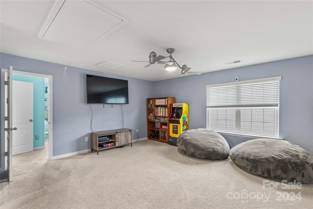 interior space with visible vents, carpet, attic access, and baseboards