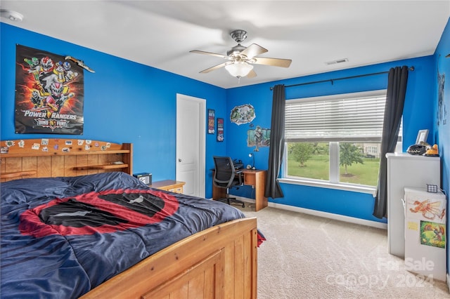 bedroom featuring visible vents, ceiling fan, light carpet, and baseboards