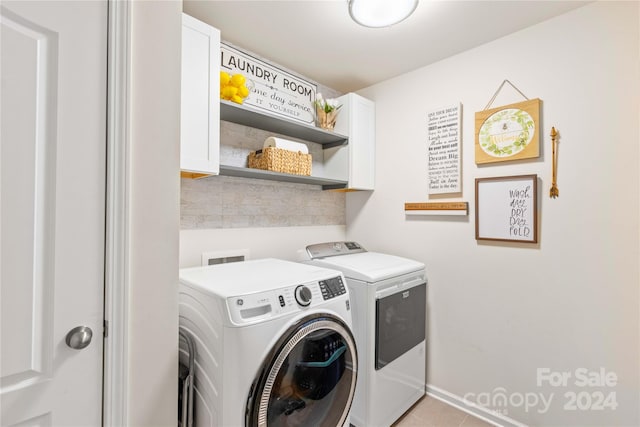 laundry area with cabinet space and washing machine and clothes dryer