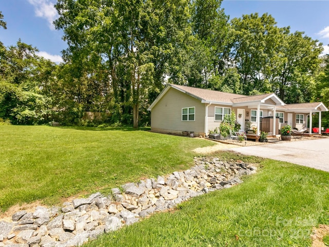 ranch-style home with a porch and a front lawn