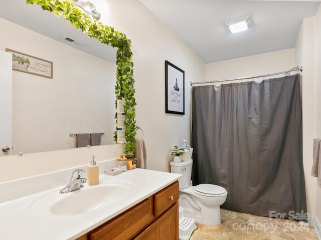 bathroom with toilet, visible vents, and vanity