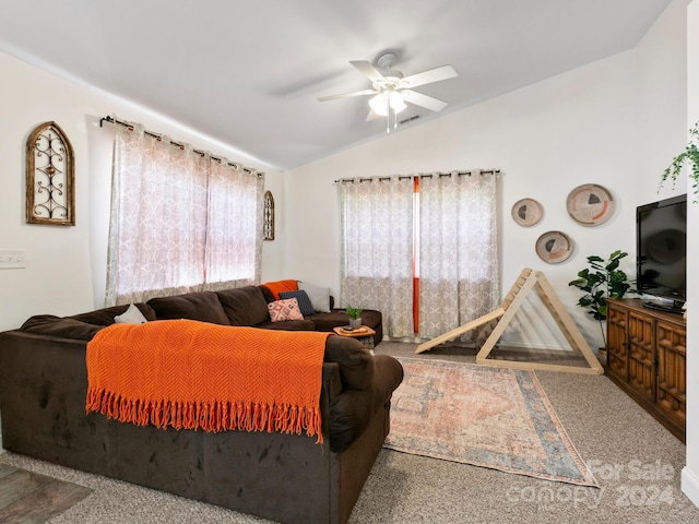 living area featuring lofted ceiling, ceiling fan, and carpet floors