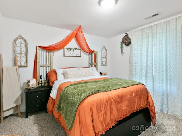 carpeted bedroom with visible vents