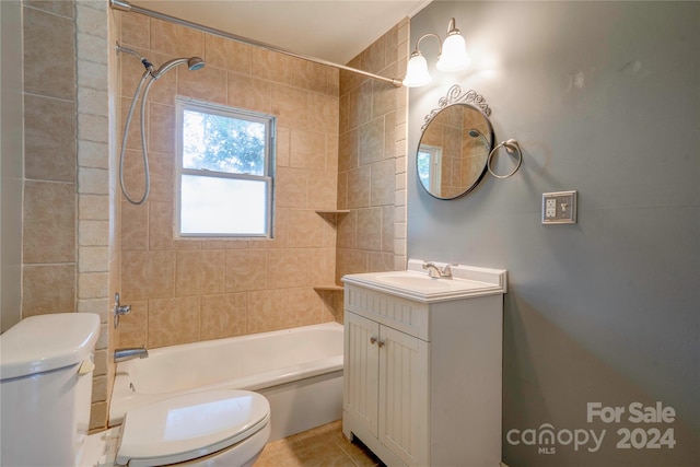 full bathroom with vanity, toilet, tile patterned floors, and tiled shower / bath