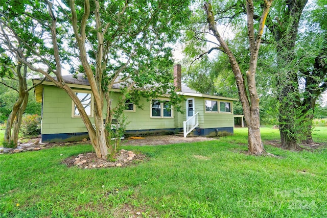 exterior space featuring a front lawn