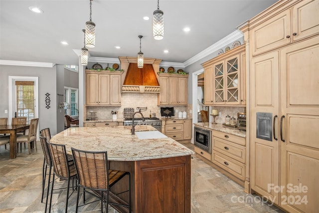 kitchen with a breakfast bar, light tile patterned flooring, stainless steel appliances, an island with sink, and custom range hood