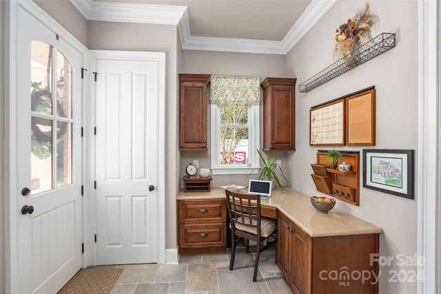 office area featuring ornamental molding and light tile patterned floors